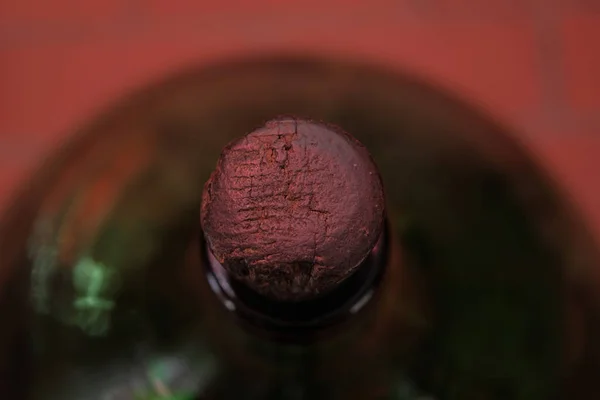wooden textured cork in a bottle of green