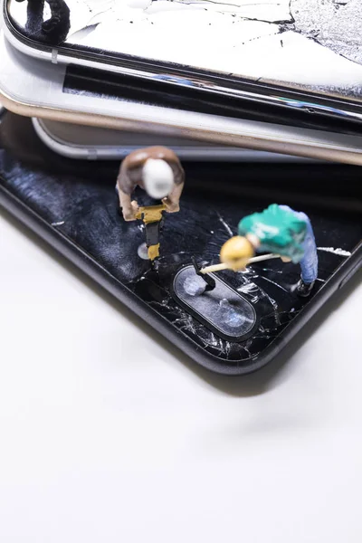 maintenance man miniature repairing phone