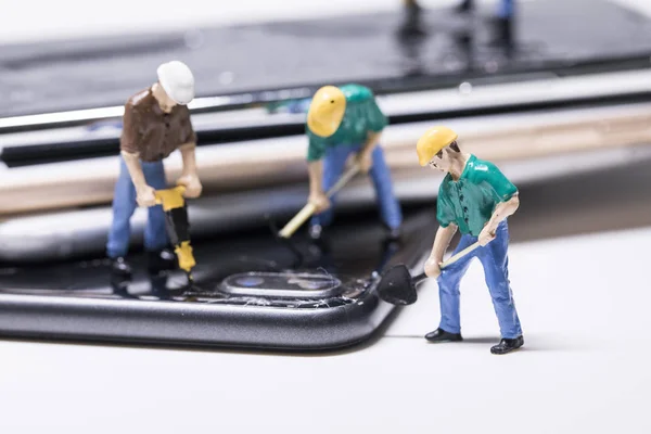 maintenance man miniature repairing phone