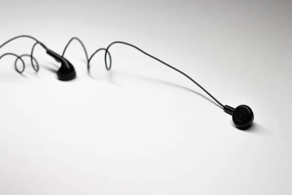 Old Black Earphones or Ear Buds on iSolated White Background. — Stock Photo, Image