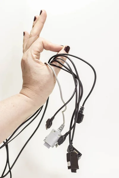 Universal usb cell phone charger in hand on isolated background