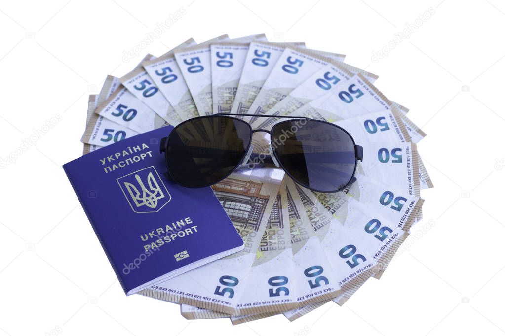Ukraine passport for traveling in Europe against the background of Euro banknotes. Concept on the theme of travel on low-cost aircraft. Cheap flights Ukrainians in Europe.