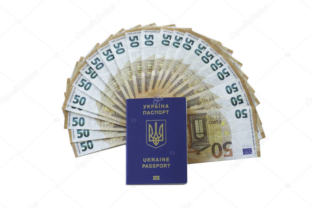 Ukraine passport for traveling in Europe against the background of Euro banknotes. Concept on the theme of travel on low-cost aircraft. Cheap flights Ukrainians in Europe.