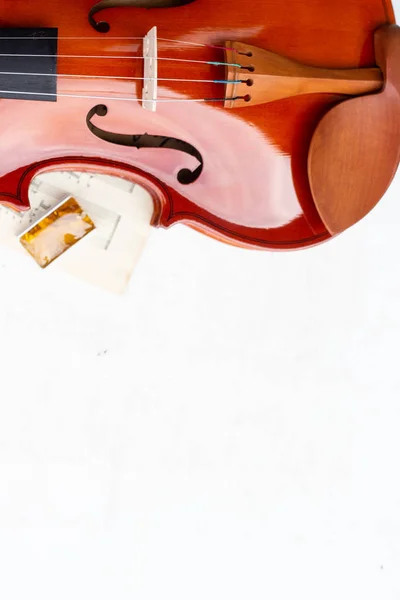 Part of the violin, bow and rosin isolated on a white background.