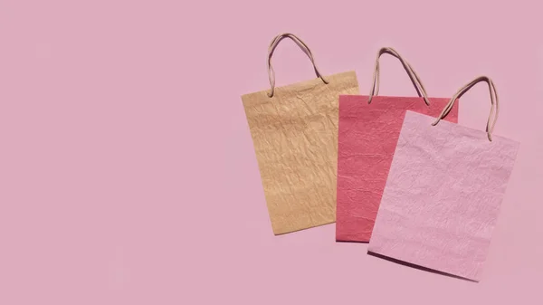 Bolsas Compras Papel Texturizado Colores Sobre Fondo Rosa Mínimo Concepto —  Fotos de Stock