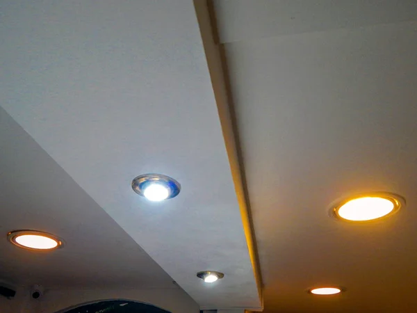 Lights on a plaster ceiling.