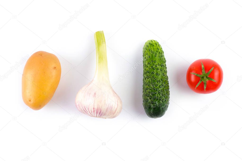 Layout made of potato, garlic, tomato and cucumber on the white background. Flat lay. Food concept.
