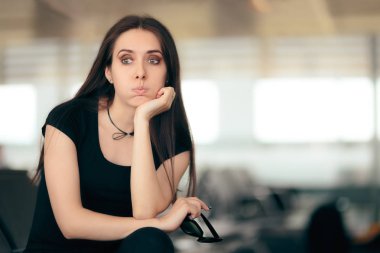 Woman in Airport Stating Waiting Room Sitting on a Chair clipart