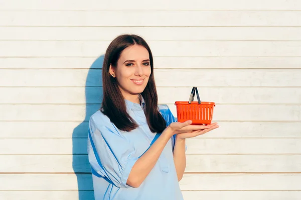 Happy Woman Holding Small Red Shopping Basket — Stock Photo, Image