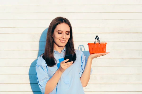 Happy Woman Holding Small Red Shopping Basket — Stock Photo, Image