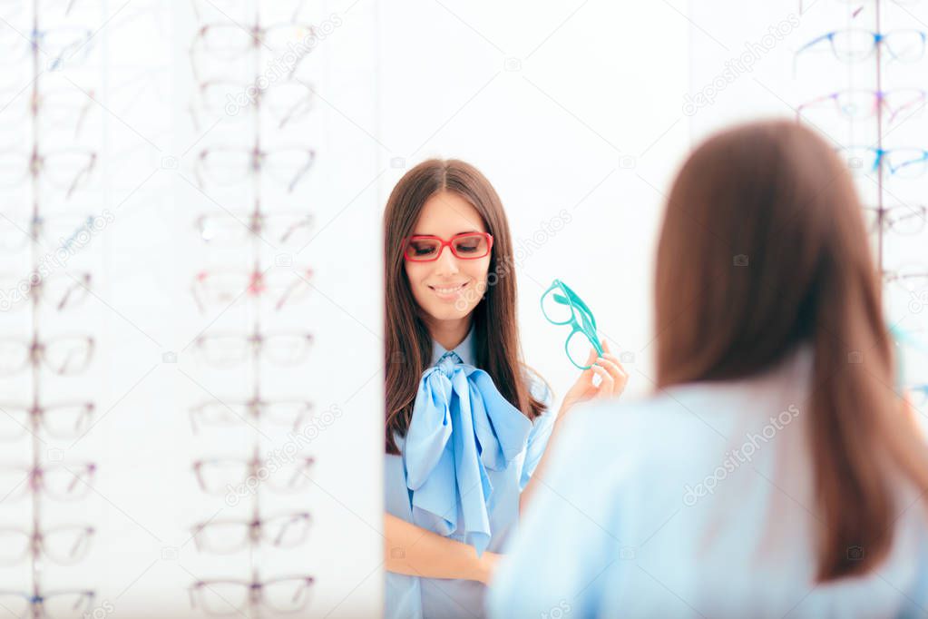 Woman Trying on Many Eyeglasses Looking in the Mirror