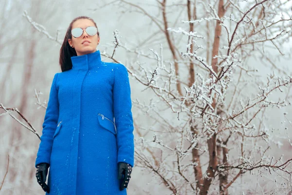 Fashion Winter Woman with Mirror Sunglasses and Blue Coat