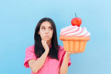 Funny Girl with Big Cupcake Thinking of her Diet clipart