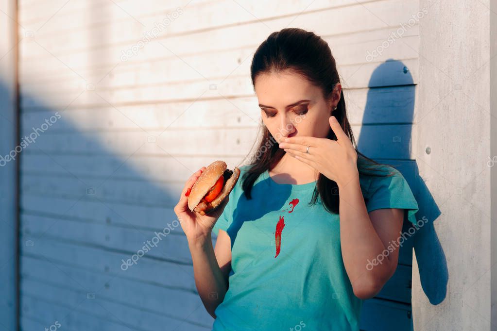 Clumsy Woman Staining Her Shirt with Ketchup Sauce