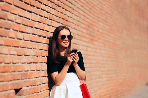 Cool Fashion Woman Checking Smartphone after Shopping Session