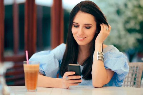 Happy Woman Checking Her Phone Drinking Juice — Stock Photo, Image