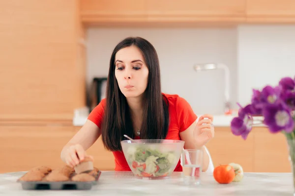 Woman Eating Cupcake Instead Apples Salad — Stock Photo, Image