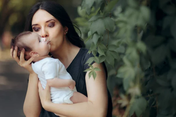 Loving Mom Kissing Baby Outdoor Portrait — Stock Photo, Image