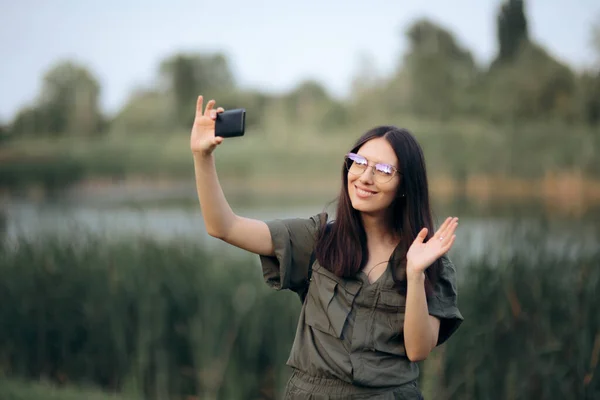 Woman in Nature Holding Smartphone for Video Call