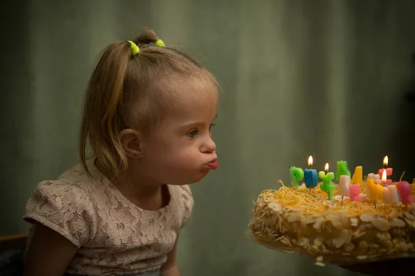 Girl Syndrome Blows Out Candles Her Birthday Cake — Stock Photo, Image