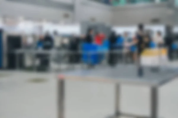security checking point with luggage x-ray at airport. blur defocused background