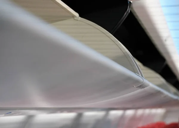 overhead baggage compartment in airplane. aircraft cabin interior