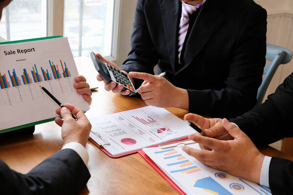 business adviser discussing with businessman & professional investor. internal auditor audit performance revenue. team meeting at office