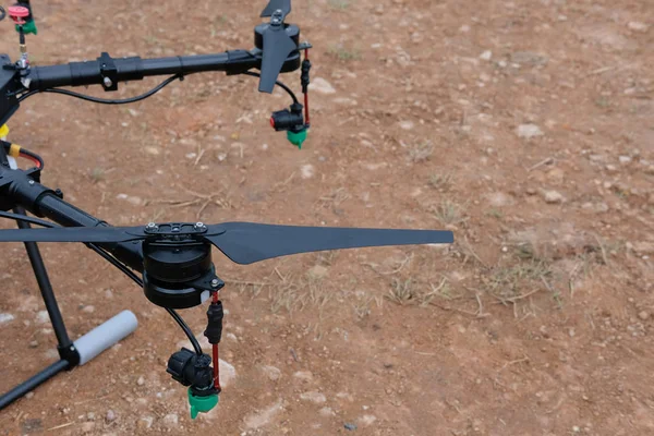 agriculture drone for spraying liquid fertilizer or herbicide in farm land.