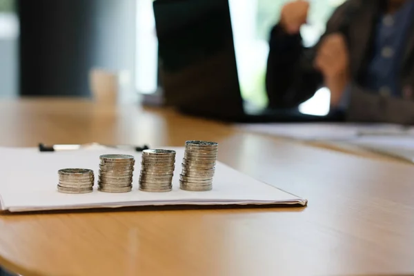 businessman working organizing plan at workplace coworking office. coins stack & business growth