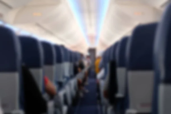 Yolcu Uçak Koltukta Oturamaz Uçak Koridorda Bulanık Ufuk Arka Plan — Stok fotoğraf