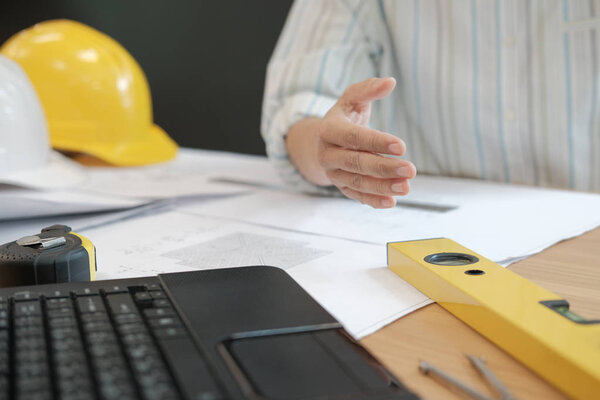 engineer offering handshake. architect ready to shake hand for building construction project