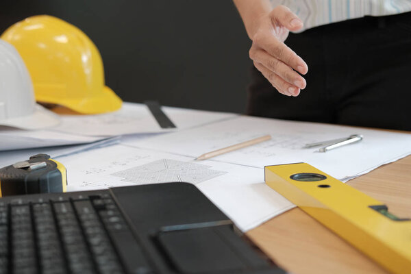 engineer offering handshake. architect ready to shake hand for building construction project