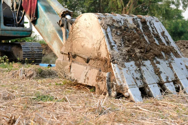 Excavator backhoe tractor at construction site — Stock Photo, Image