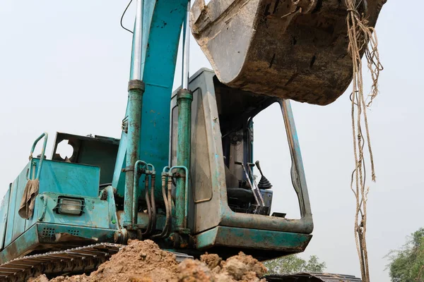 Excavator backhoe tractor at construction site — Stock Photo, Image