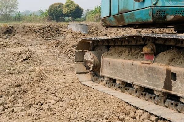 Excavator backhoe tractor at construction site — Stock Photo, Image