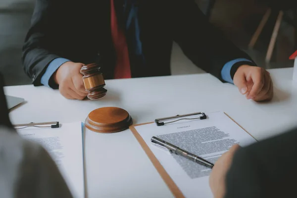 lawyer insurance broker consulting giving legal advice to couple