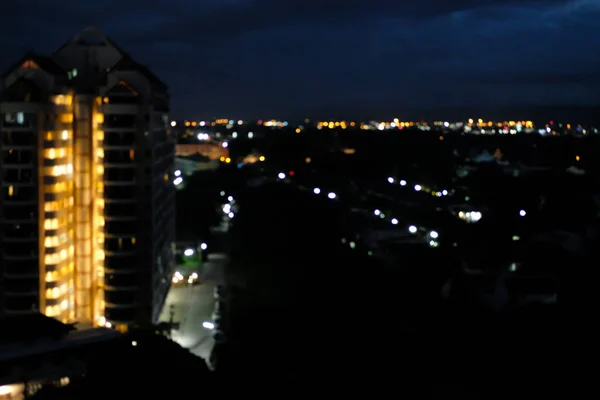 Ciudad noche luz bokeh desenfocado borrosa fondo — Foto de Stock