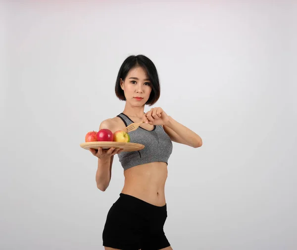 Femme de fitness sportive en vêtements de sport avec pomme. sport sain li — Photo