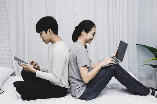 man woman friends using computer tablet. startup teamwork team working together at home