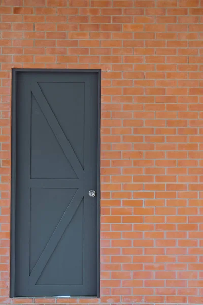 New Gray Wooden Door Orange Brick Wall — Stock Photo, Image