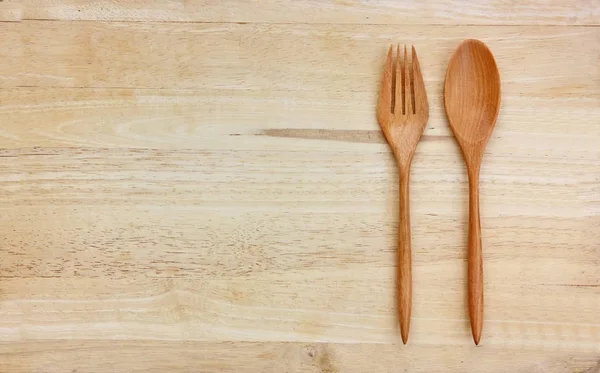 top view wood spoon,fork on wood floor  with copy space,
