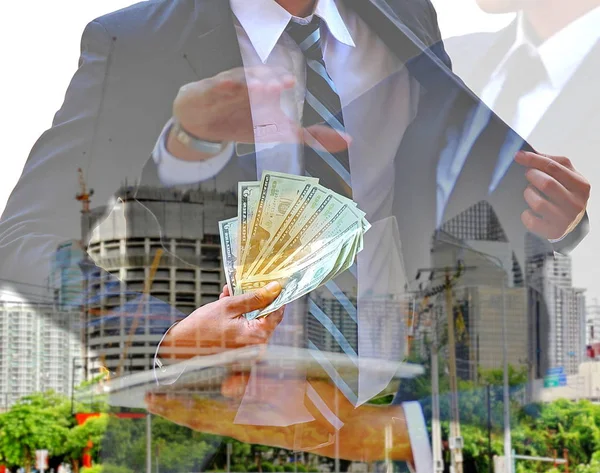 double exposure of business man and building designer in suit  with construction building background. investor take money to joint venture or consultation in real estate business,business concept.