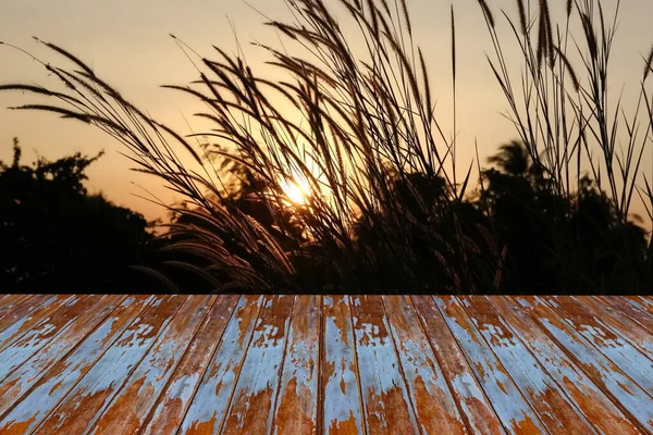 perspective retro wood with grass petal sunset background