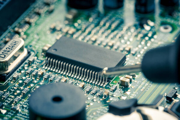 Close Up - Technician engineer measuring multimeter computer circuit board motherboard (Technology repairing computer Hardware)