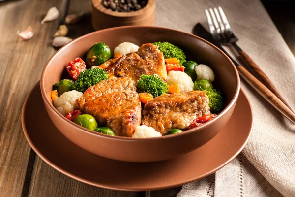 Meat stew with vegetables in a thick sauce.