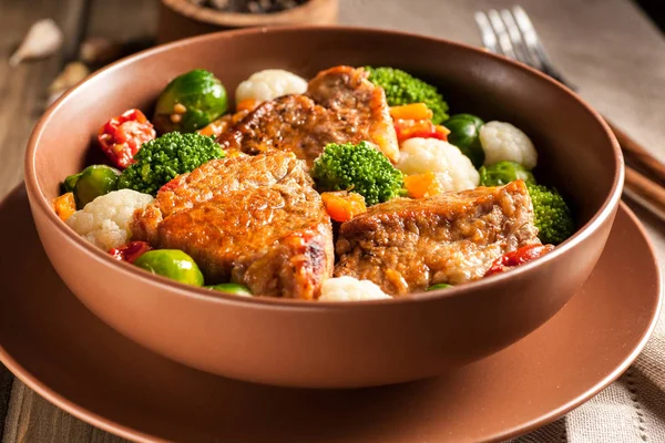Meat stew with vegetables in a thick sauce.