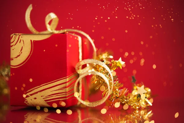 Red Gift Box Golden Ribbons Red Background — Stock Photo, Image