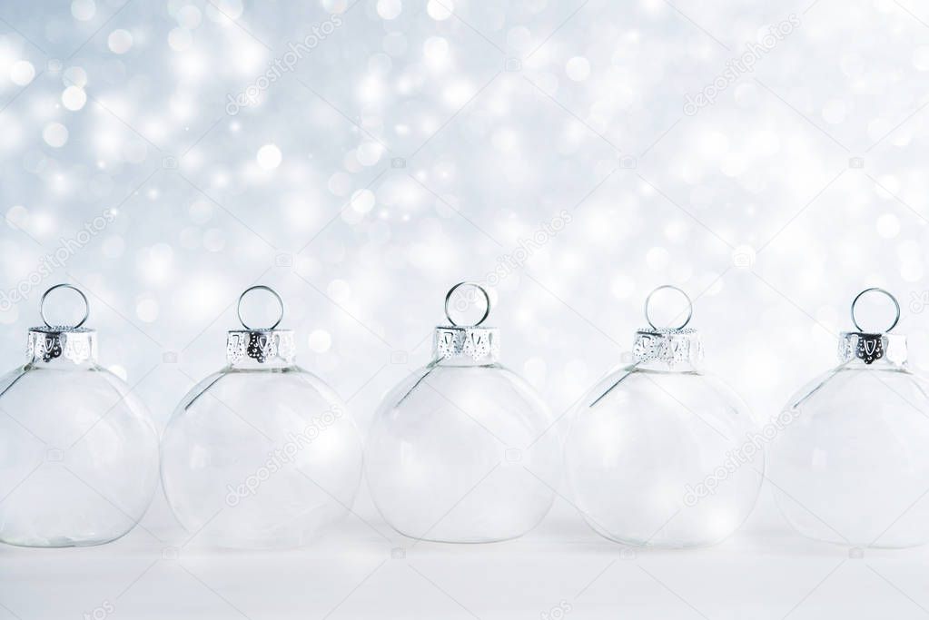 White christmas ornaments on glitter background 