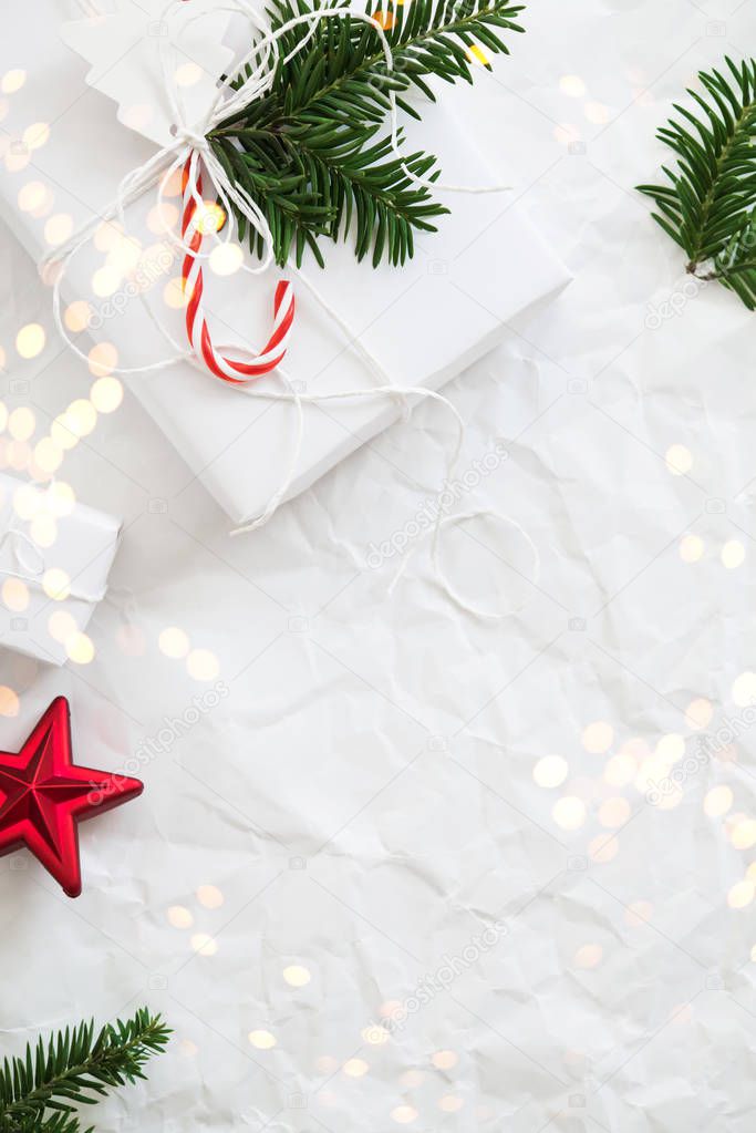 Christmas white handmade gift boxes on white crumpled background top view. Merry Christmas greeting card, frame. Winter xmas holiday theme. Happy New Year. Flat lay