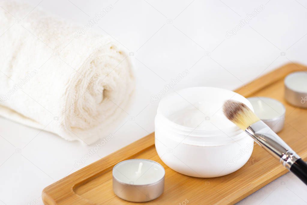 Cosmetics flat lay on white background